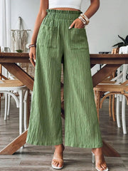 Textured wide-leg palazzo trousers in Matcha Green with elastic waist and front pockets.