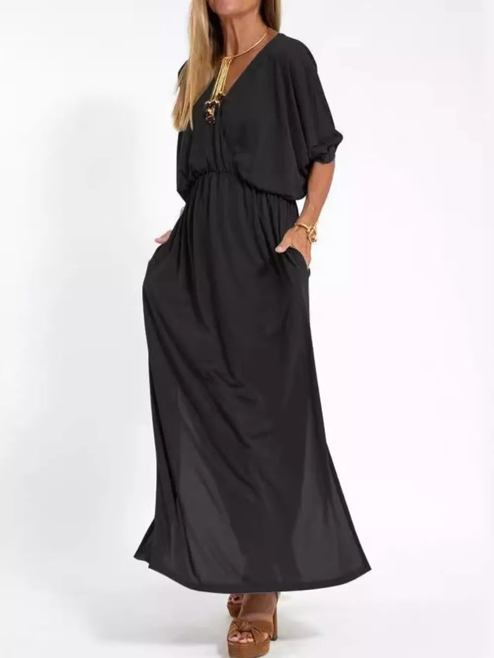 Black V-neck maxi dress with dolman sleeves, elastic waist, side pockets, and side slits.
