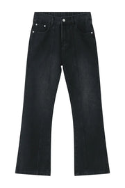 Dark wash denim trousers with vertical seams and a wide-leg flare.