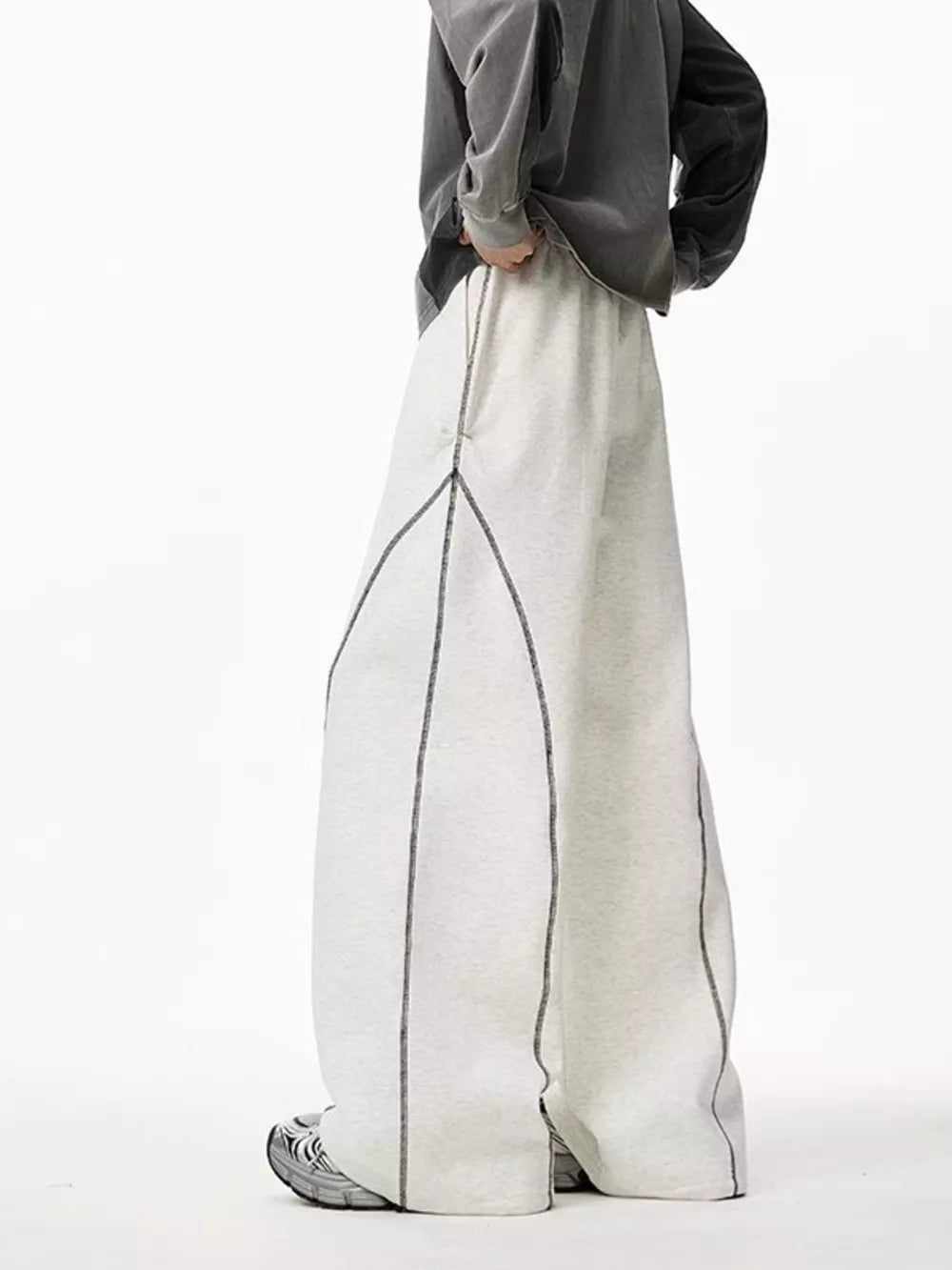Light gray wide-leg sweatpants with contrast stitching detail and drawstring waist.