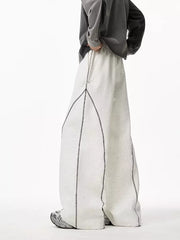 Light gray wide-leg sweatpants with contrast stitching detail and drawstring waist.