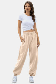 Relaxed-fit tan sweatpants with cuffed ankles and drawstring waist.