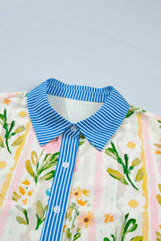Floral print shift dress with button-down front and blue striped collar and placket.