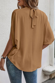 Camel blouse with short drape sleeves and a tie-back keyhole detail