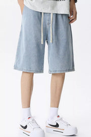 Light blue denim shorts for men with drawstring waist and relaxed fit.