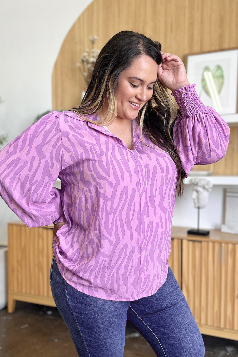 Lavender zebra print blouse with shirred cuffs and collared neckline.