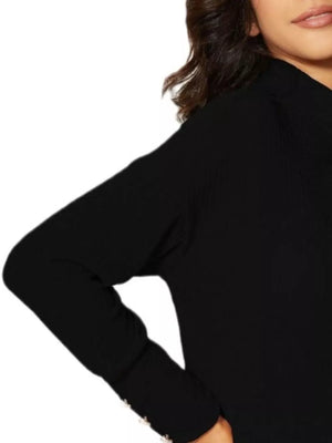 Black ribbed turtleneck knit top with decorative buttons on the cuff.
