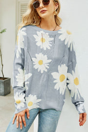 Light gray intarsia knit sweater with allover white daisy pattern and cable knit details.