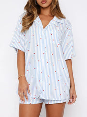 Light Blue striped pajama set with red hearts, collared button-up top and shorts.