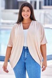 Tan ribbed batwing cardigan with drape front and short sleeves.