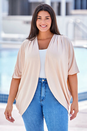 Tan ribbed batwing cardigan with drape front and short sleeves.