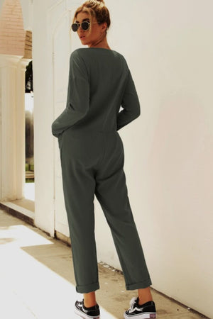 Relaxed linen-blend jumpsuit in army green with button details and cuffed ankles.