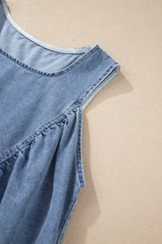 V-shaped pleated denim sleeveless top in light blue with a relaxed fit.