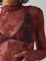 Deep Red floral lace illusion mock neck long sleeve blouse with sheer sleeves.