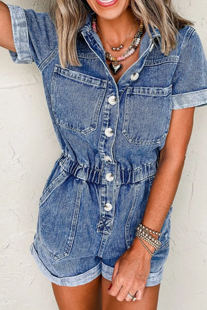 Medium wash denim romper with button-down front, elastic waist, and cuffed short legs.