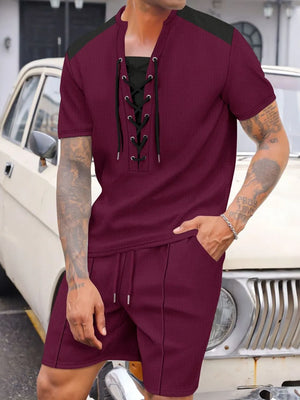Burgundy waffle knit lounge set with lace-up neckline and drawstring shorts.