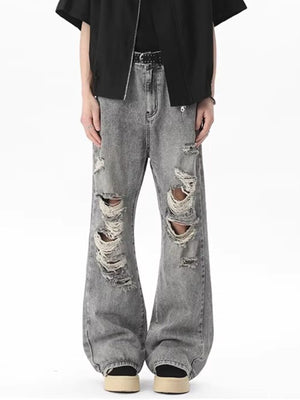Men's light gray distressed wide-leg jeans with frayed details.