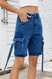 Medium blue denim cargo shorts with straps and flap pockets.