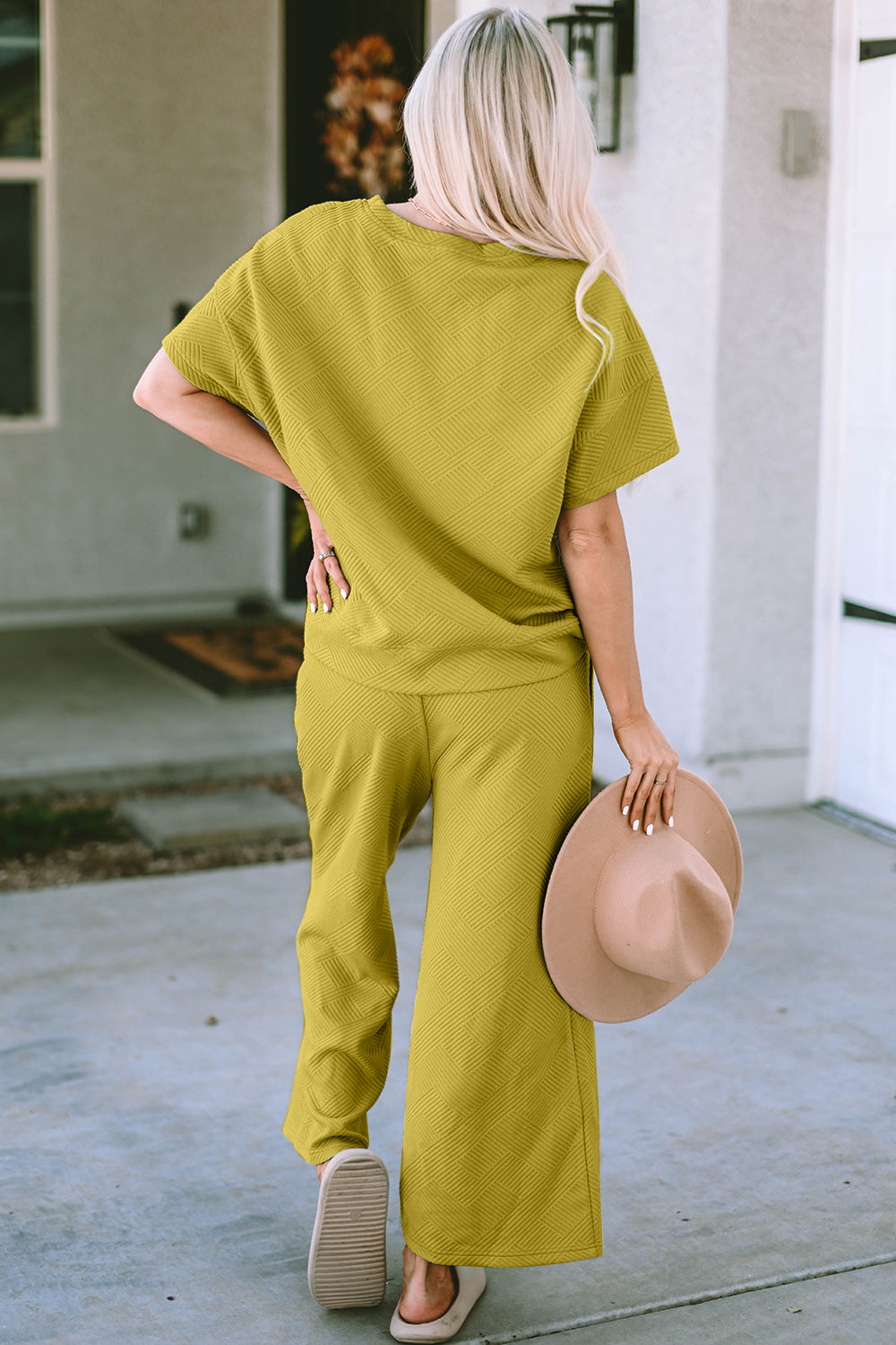 Textured knit tee and wide leg pants set in chartreuse, with a geometric pattern.