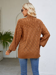 Camel open-knit balloon sleeve cardigan with textured pattern and ribbed hem.