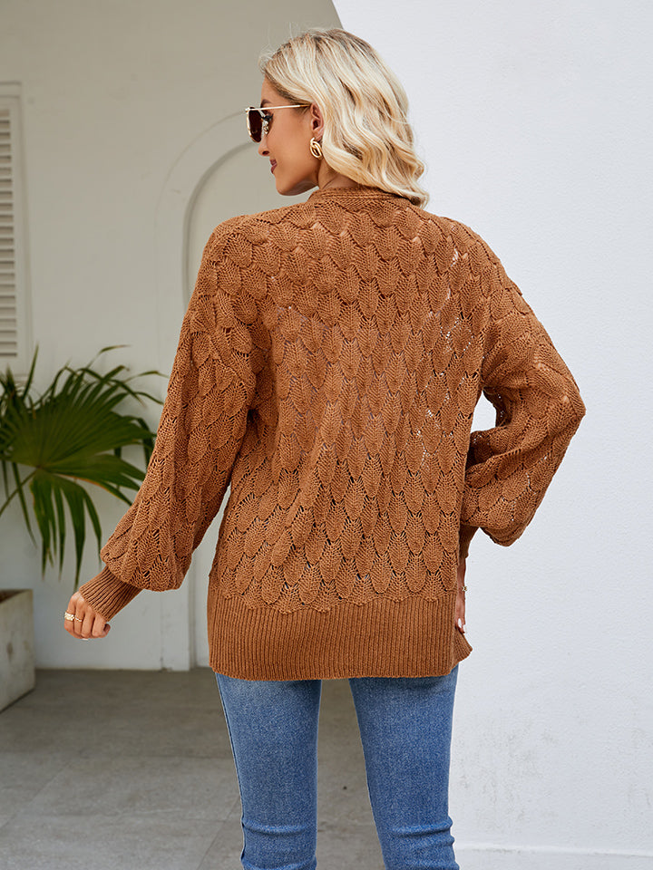Camel open-knit balloon sleeve cardigan with textured pattern and ribbed hem.
