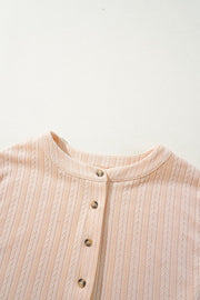 Textured ribbed collar jumpsuit in eggshell with button detail