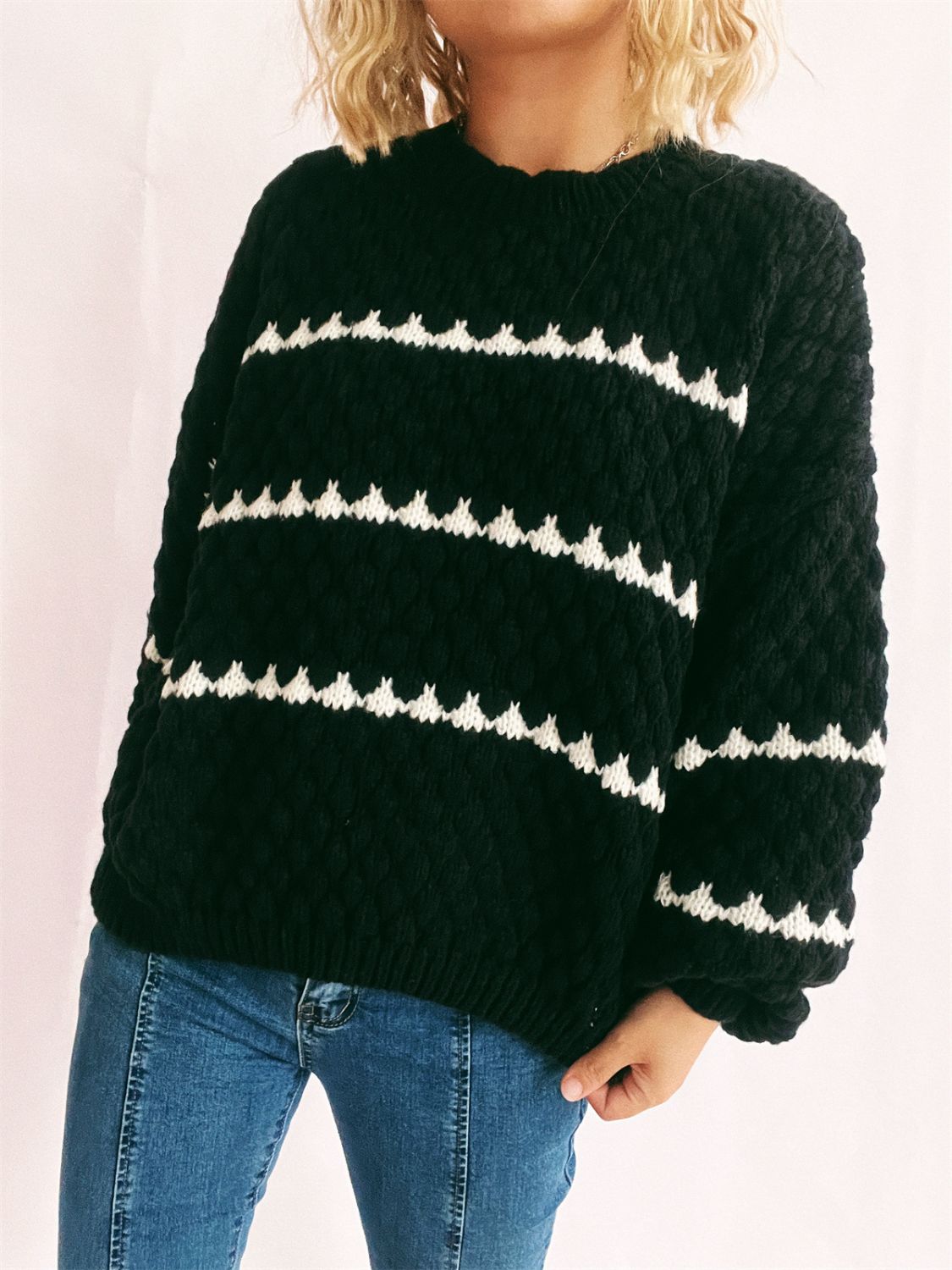 Black acrylic knit jumper with textured chevron stripes and a crew neck.
