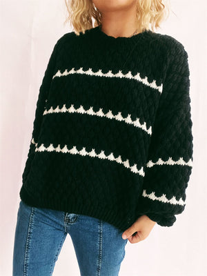 Black acrylic knit jumper with textured chevron stripes and a crew neck.