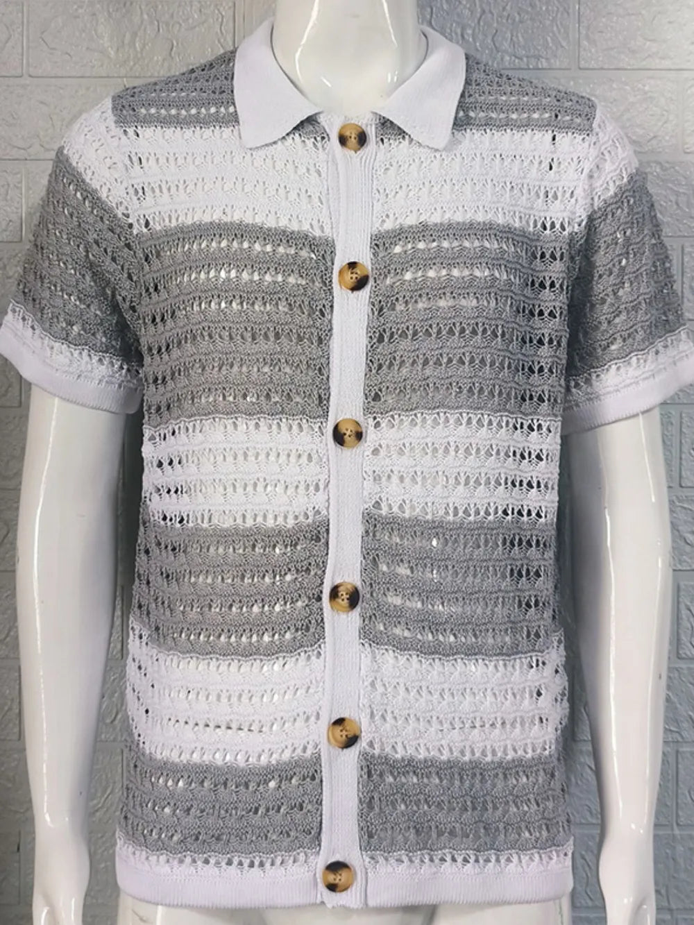 Striped crochet polo shirt in gray and white with button front and short sleeves.