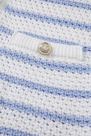 Light blue and white striped knit vest with pocket detail and button.