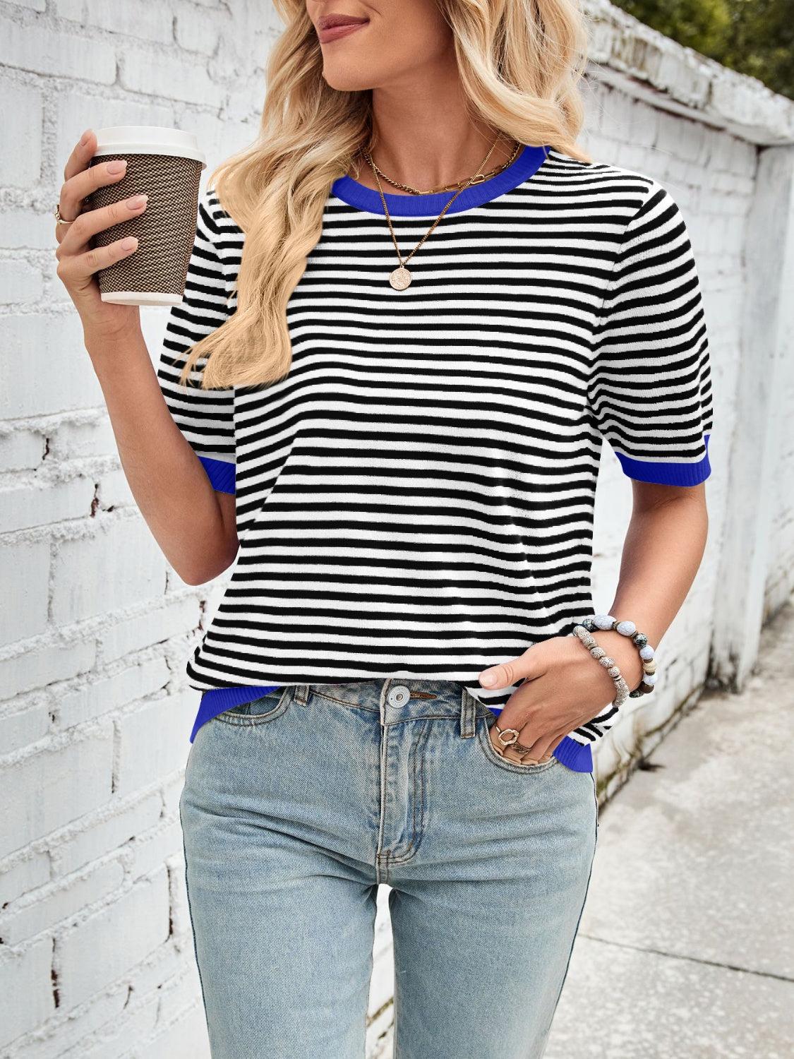 Striped knit tee with blue trim and short sleeves.