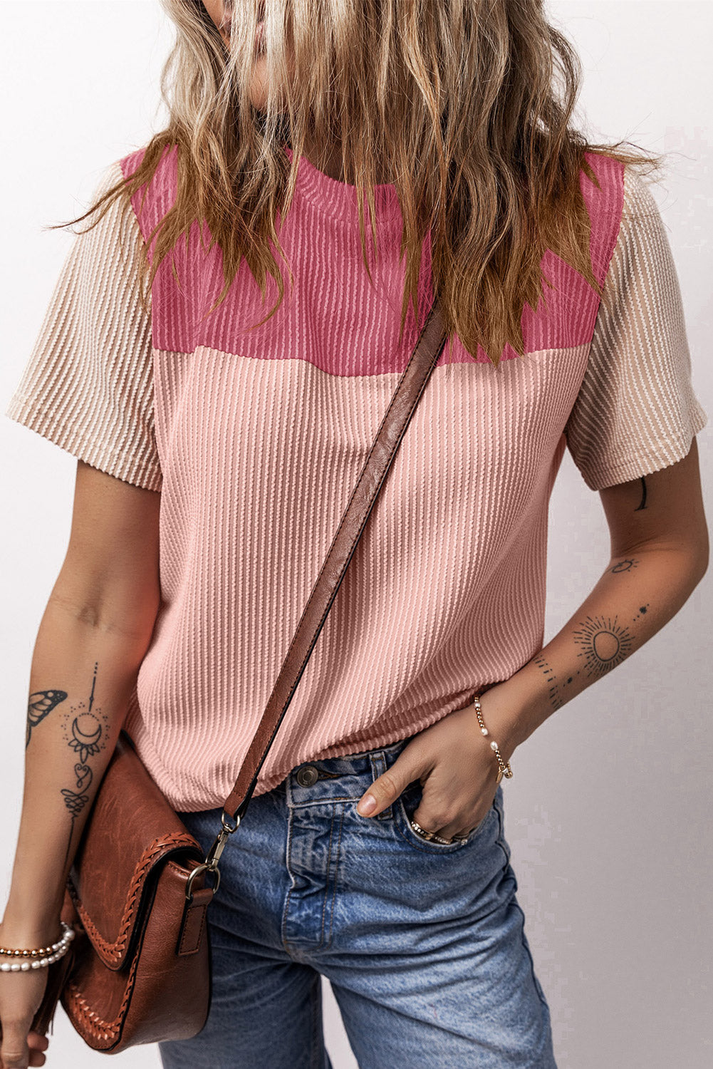 Panelled ribbed tee in pink and blush with textured beige sleeves and crew neck.