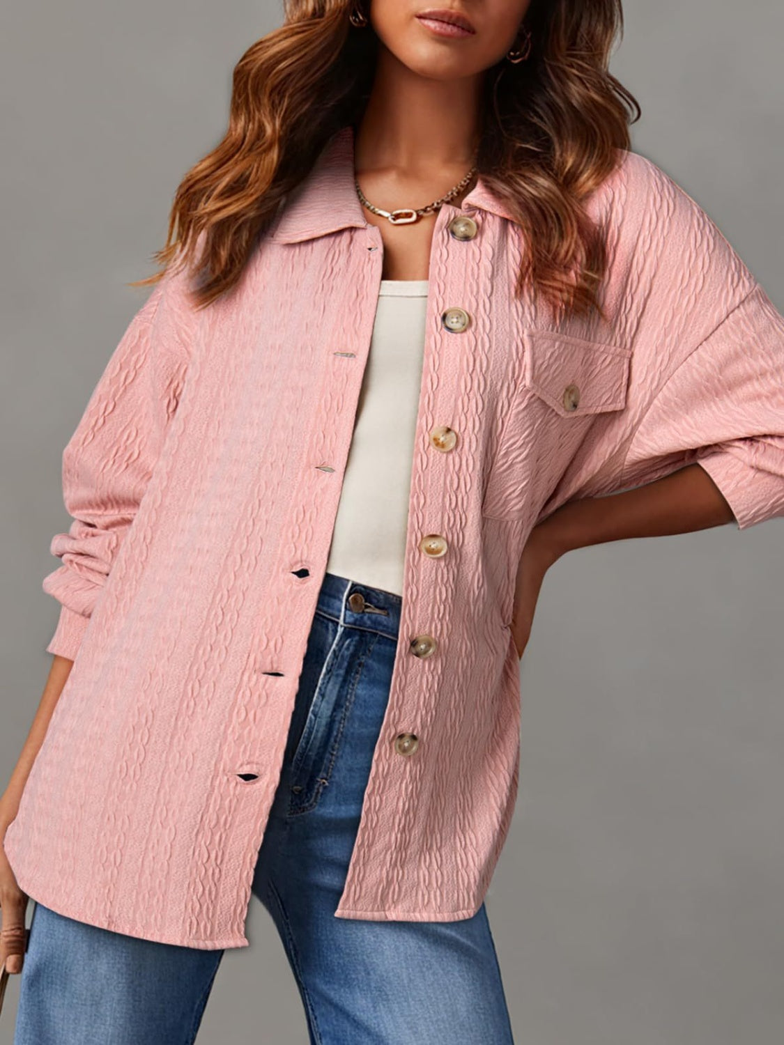 Textured oversized button-down shacket in blush pink with buttoned pockets and collar.