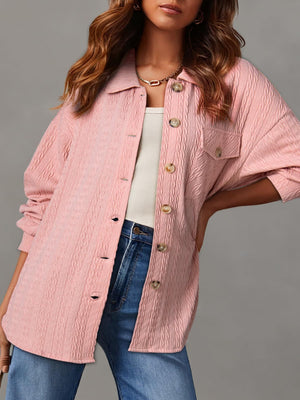 Textured oversized button-down shacket in blush pink with buttoned pockets and collar.