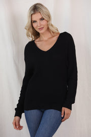 Black relaxed knit v-neck pullover sweater with long sleeves.