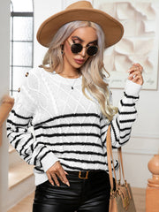 White cable-knit sweater with black stripes and shoulder buttons