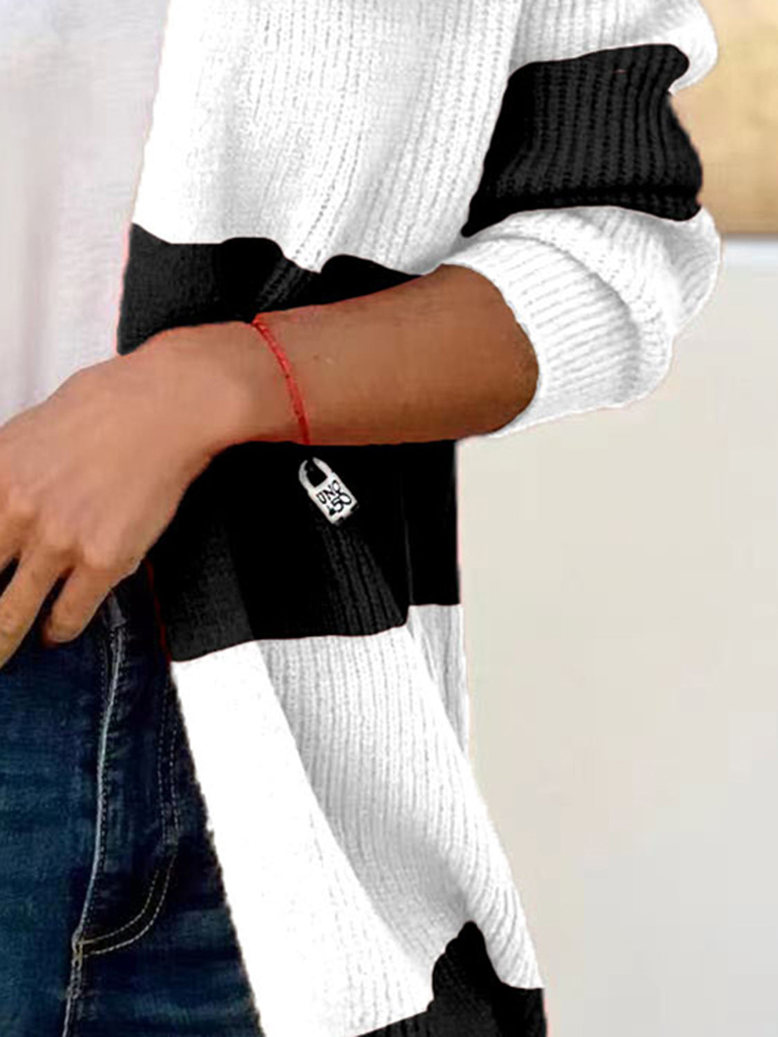 Colorblock ribbed open-front cardigan in black and white with a relaxed fit.