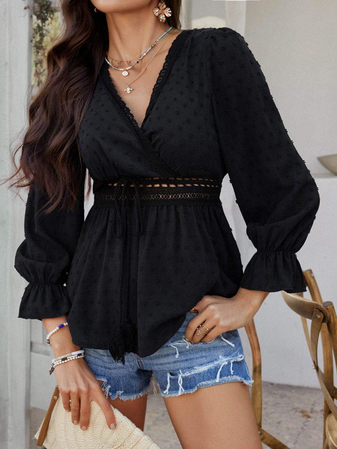 Black Swiss dot wrap blouse with lace trim and tie waist