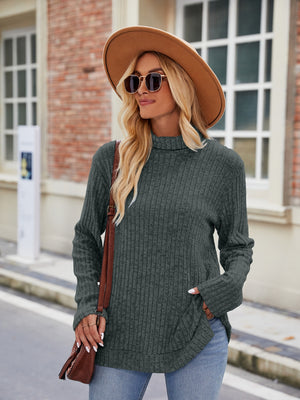 Ribbed turtleneck sweater in Army Green with side slits and long sleeves.