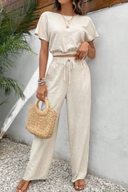 Beige textured crop top and wide-leg trousers set with drawstring waist