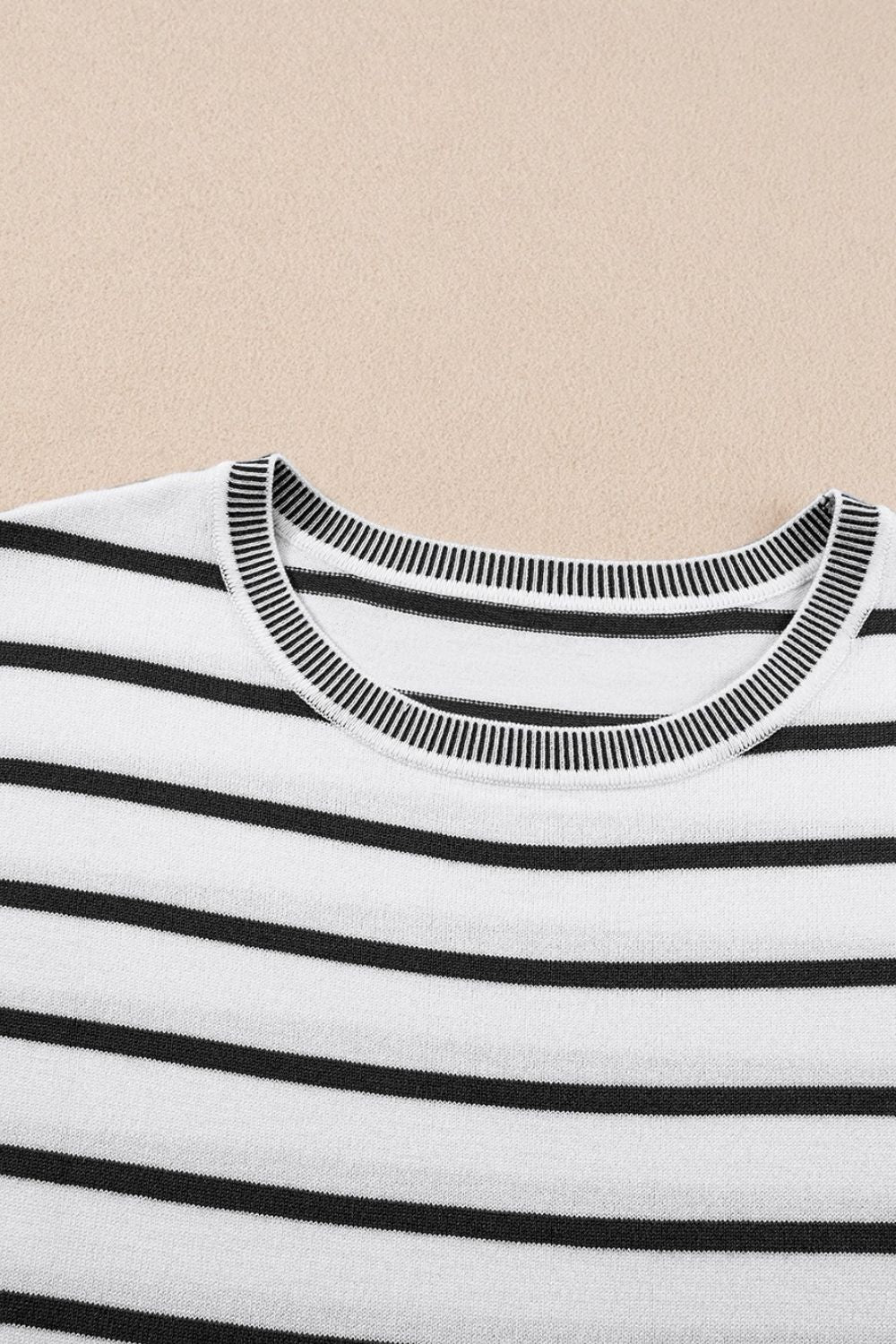 White and black striped boxy tee with contrast ribbed neckline and cuffs.