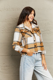 Camel plaid shacket with contrast collar, buttoned front, and chest pockets.
