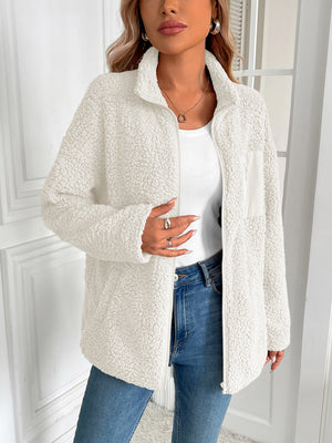 White teddy fleece jacket with zip front and patch pocket detail.