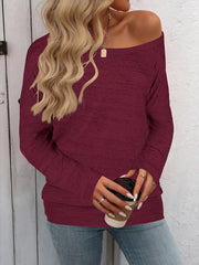Burgundy heathered knit off-the-shoulder top with long sleeves.