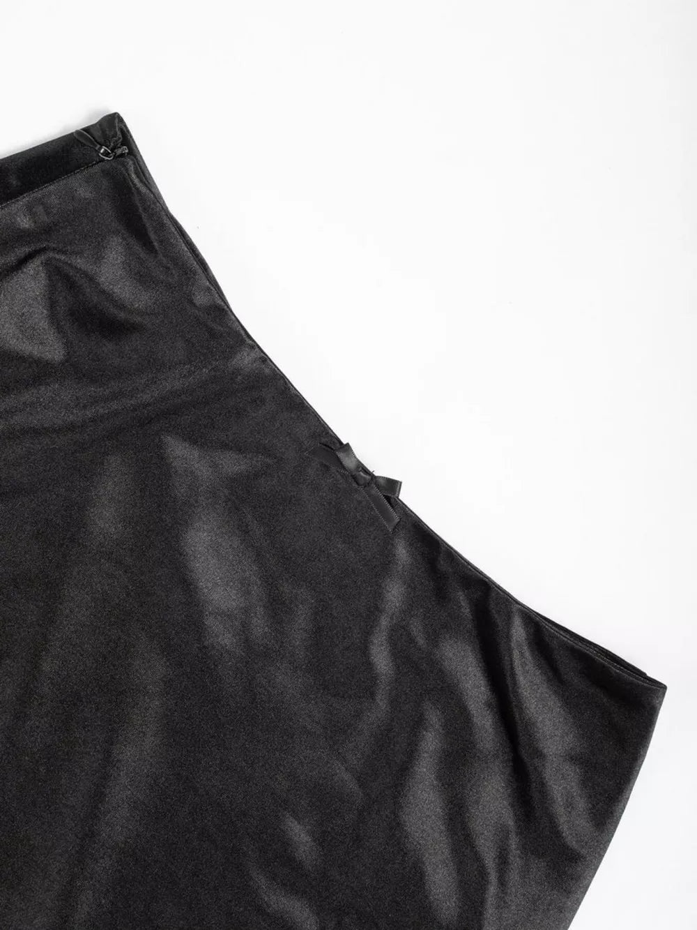 Black satin maxi skirt with bow detail and zipper closure