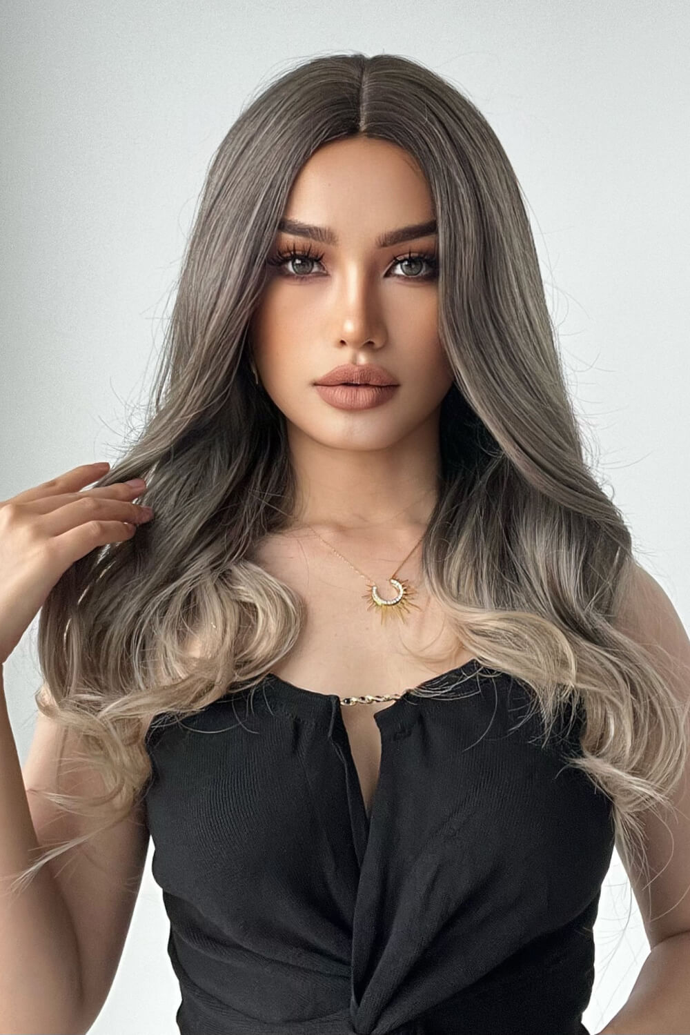 Ombre Wave Synthetic Wig in Ash Brown/Blonde, styled with loose waves and a center part.