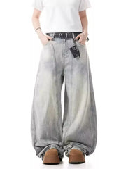 Baggy light wash denim jeans with a belted waist and wide leg.
