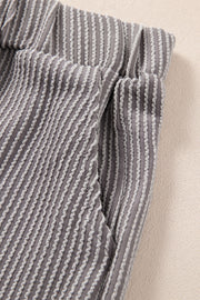 Textured ribbed tank and shorts set in dark gray with a wavy vertical stripe pattern.