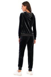 Black velvet loungewear set with hooded jacket and cuffed pants