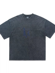 Oversized graphic tee in charcoal wash cotton with relaxed fit and blue graphic print.